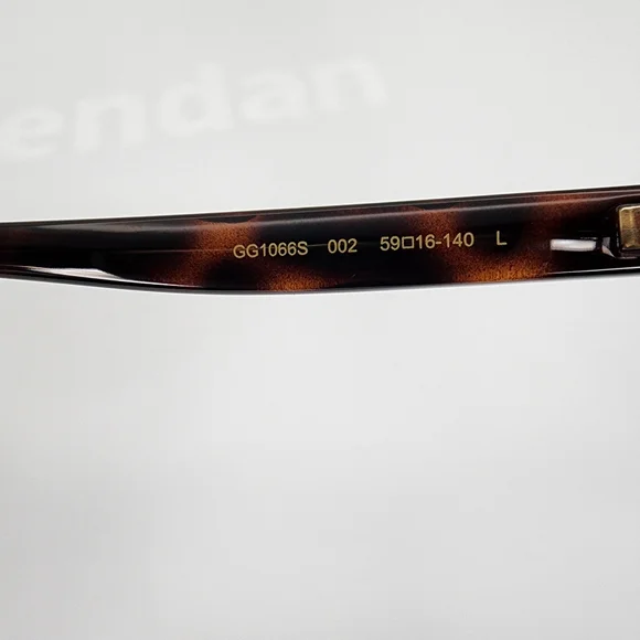 Gucci GG1066S 002 Womens Tortoise Shell Sunglasses display picture 1